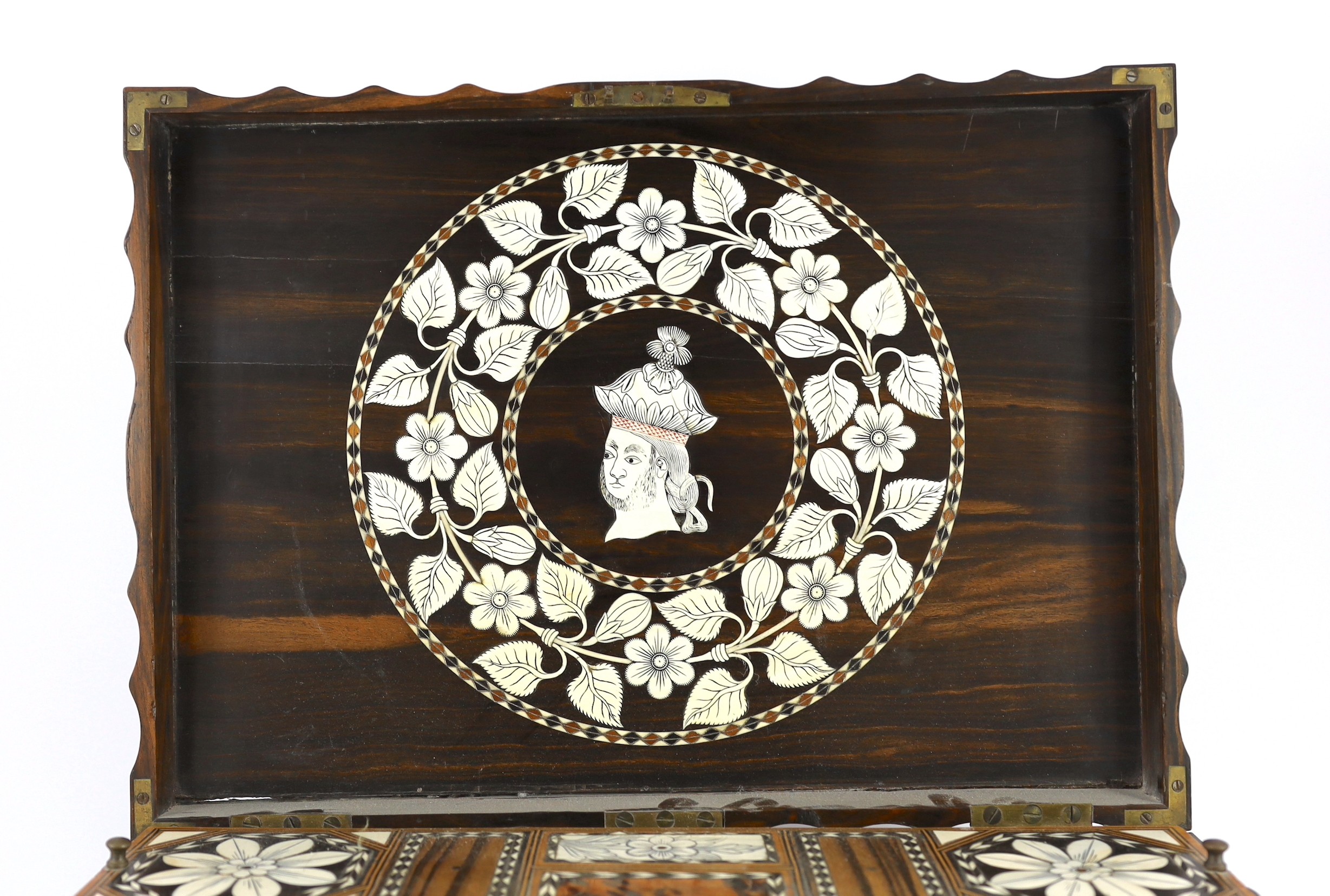 A mid 19th century Anglo Indian ivory inset ebony and other exotic hardwood travelling casket, 44cm wide 32cm deep 19cm high